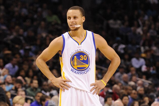 Nov 28, 2014; Charlotte, NC, USA; Golden State Warriors guard Stephen Curry (30) stands on the court during a time out in the second half of the game against the Charlotte Hornets at Time Warner Cable Arena. Warriors win 106-101. Mandatory Credit: Sam Sharpe-USA TODAY Sports