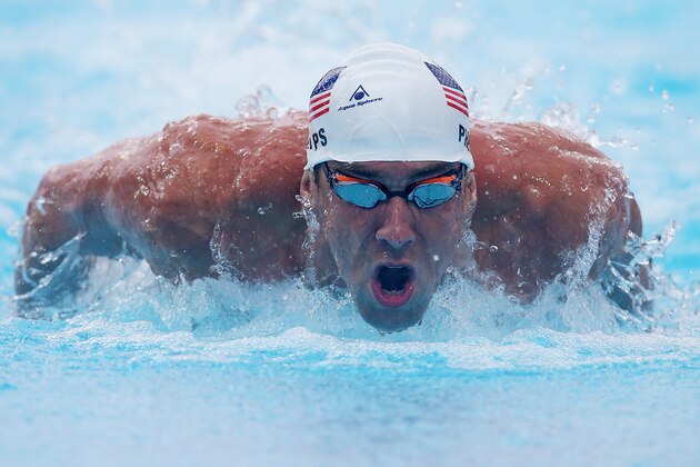 GOLD COAST, AUSTRALIA - AUGUST 23:  Michael Phelps of the USA swims the Men's 100m Butterfly heats during day three of the 2014 Pan Pacific Championships at Gold Coast Aquatics on August 23, 2014 in Gold Coast, Australia.  (Photo by Chris Hyde/Getty Images)