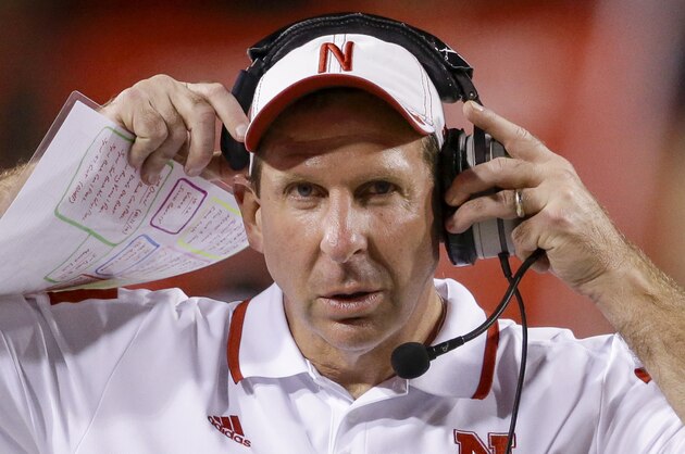 Nebraska coach Bo Pelini adjusts his headset in the second half of an NCAA college football game against Miami in Lincoln, Neb., Saturday, Sept. 20, 2014. Nebraska won 41-31. (AP Photo/Nati Harnik)