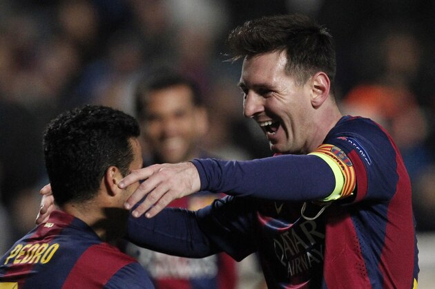 Barcelona's Lionel Messi celebrates with teammates scoring his side's 4th goal during a Champions League Group F soccer match between APOEL and FC Barcelona at GSP stadium, in Nicosia, Cyprus, Tuesday, Nov. 25, 2014. (AP Photo/Petros Karadjias)