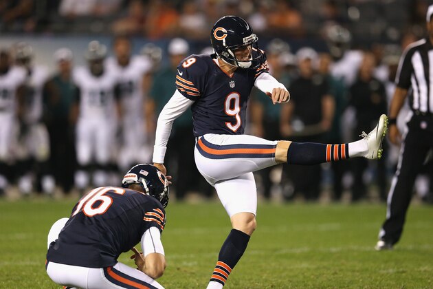 CHICAGO, IL - AUGUST 08:  Robbie Gould #9 of the Chicago Bears kicks a field goal out of the hold of Patrick O'Donnell #16 against the Philadelphia Eagles during a preseason game at Soldier Field on August 8, 2014 in Chicago, Illinois. The Bears defeated the Eagles 34-28.  (Photo by Jonathan Daniel/Getty Images)