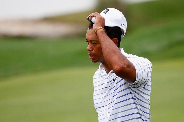 LOUISVILLE, KY - AUGUST 08: Tiger Woods of the United States tips his cap after playing the 18th hole during the second round of the 96th PGA Championship at Valhalla Golf Club on August 8, 2014 in Louisville, Kentucky.  (Photo by Sam Greenwood/Getty Images)