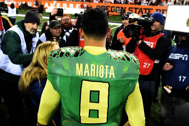 CORVALLIS, OR - NOVEMBER 29:  Quarterback Marcus Mariota #8 of the Oregon Ducks speaks with the media after the game against the Oregon State Beavers at Reser Stadium on November 29, 2014 in Corvallis, Oregon.  (Photo by Steve Dykes/Getty Images)