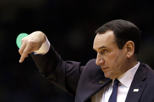 Duke coach Mike Krzyzewski directs his team against Army during the second half of an NCAA college basketball game in Durham, N.C., Sunday, Nov. 30, 2014. Duke won 93-73. (AP Photo/Gerry Broome)