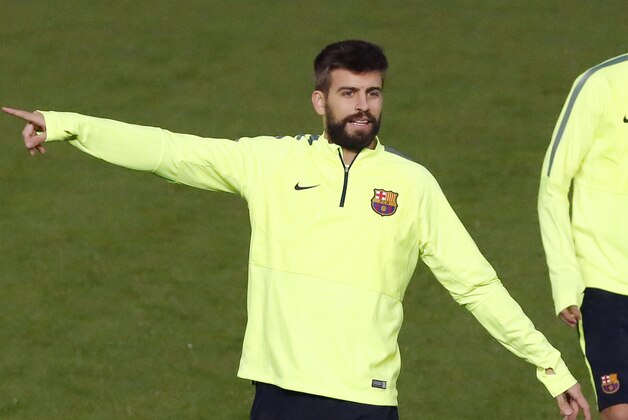 Barcelona's Gerad Pique, gestures,  during a training session at GSP stadium, in Nicosia, Cyprus,  Monday, Nov. 24, 2014. APOEL will play Barcelona in a Champions League Group F soccer match on Tuesday. (AP Photo/Petros Karadjias)