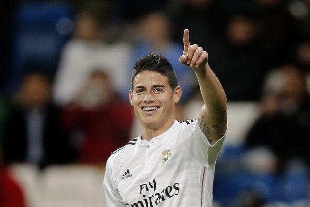 Real Madrid’s James from Colombia celebrates after scoring a goal during a Spanish King’s Cup soccer match against Cornella at the Bernabeu stadium in Madrid, Spain, Tuesday, Dec. 2, 2014 . (AP Photo/Daniel Ochoa de Olza)