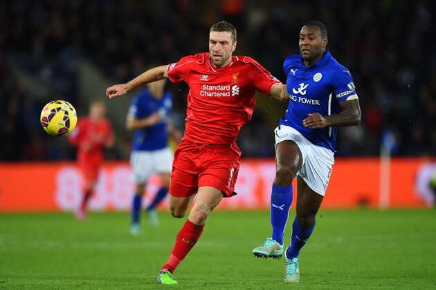 LEICESTER, ENGLAND - DECEMBER 02:  Rickie Lambert of Liverpool holds off the challenge from Wes Morgan of Leicester City during the Barclays Premier League match between Leicester City and Liverpool at The King Power Stadium on December 2, 2014 in Leicester, England.  (Photo by Shaun Botterill/Getty Images)
