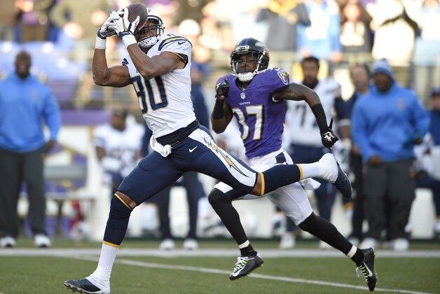 San Diego Chargers wide receiver Malcom Floyd, left, makes a catch in front of Baltimore Ravens defensive back Danny Gorrer in the second half of an NFL football game, Sunday, Nov. 30, 2014, in Baltimore. (AP Photo/Nick Wass)