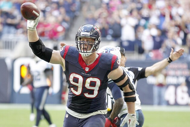 HOUSTON, TX - NOVEMBER 30: J.J. Watt #99 of the Houston Texans celebrates recovering Jake Locker #10 of the Tennessee Titans fumble in the fourth quarter in a NFL game on November 30, 2014 at NRG Stadium in Houston, Texas. (Photo by Bob Levey/Getty Images)