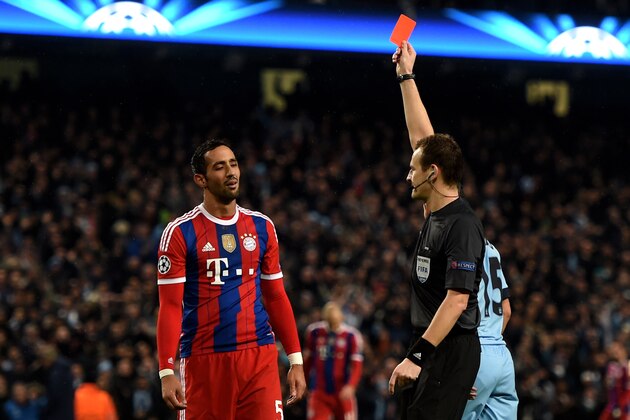 MANCHESTER, ENGLAND - NOVEMBER 25:  Mehdi Benatia of Bayern Muenchen is shown the red card by referee Pavel Kralovec of the Czech Republic  during the UEFA Champions League Group E match between Manchester City and FC Bayern Muenchen at the Ethad Stadium on November 25, 2014 in Manchester, United Kingdom.  (Photo by Michael Regan/Getty Images)