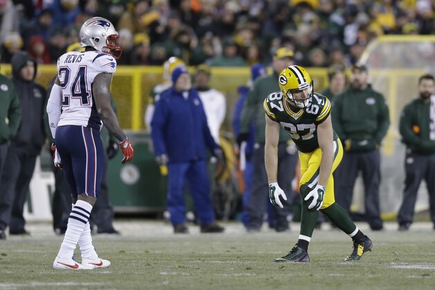 New England Patriots' Darrelle Revis (24) and Green Bay Packers' Jordy Nelson (87) line up during the second half of an NFL football game Sunday, Nov. 30, 2014, in Green Bay, Wis. (AP Photo/Tom Lynn)