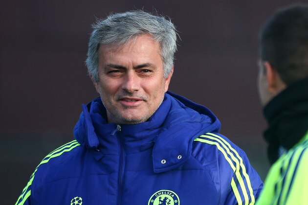 COBHAM, ENGLAND - NOVEMBER 24: Chelsea manager Jose Mourinho chats with Cesar Azpilicueta as they make their way out to the session during a Chelsea Training Session ahead of their Champions League fixture against FC Schalke on November 24, 2014 in Cobham, England. (Photo by Charlie Crowhurst/Getty Images)