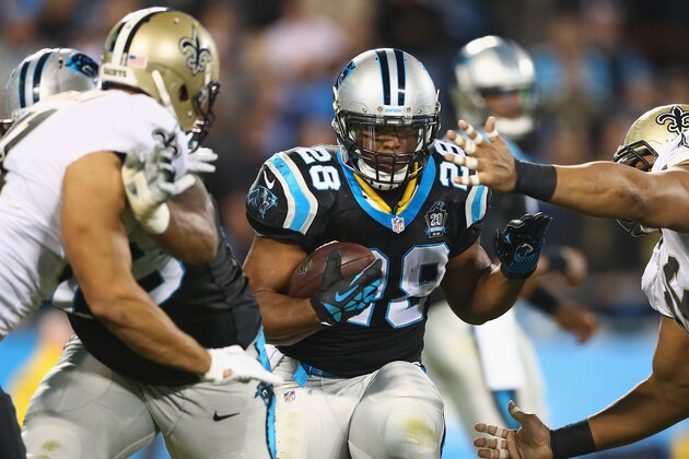 CHARLOTTE, NC - OCTOBER 30:   Jonathan Stewart #28 of the Carolina Panthers runs the ball against the New Orleans Saints defense in the 1st half during their game at Bank of America Stadium on October 30, 2014 in Charlotte, North Carolina.  (Photo by Streeter Lecka/Getty Images)