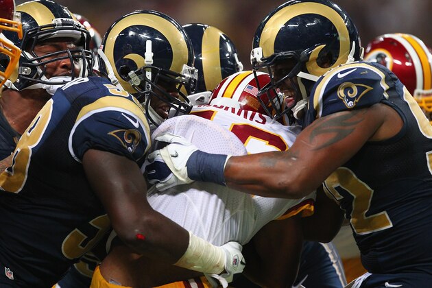 ST. LOUIS, MO - SEPTEMBER 16: Jo-Lonn Dunbar #58 and Eugene Sims #92 both of the St. Louis Rams tackle Alfred Morris #46 of the Washington Redskins at the Edward Jones Dome on September 16, 2012 in St. Louis, Missouri.  (Photo by Dilip Vishwanat/Getty Images)