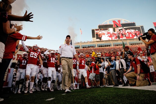 LINCOLN, NE - SEPTEMPER 20: Bo Pelini and the Nebraska Cornhuskers prepare to take the field before their game against the Miami Hurricanes at Memorial Stadium on September 20, 2014 in Lincoln, Nebraska. Nebraska defeated Miami 41-31. (Photo by Eric Francis/Getty Images)
