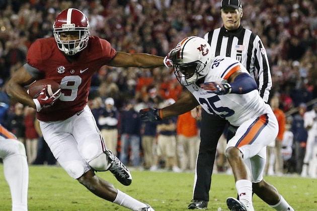 Alabama wide receiver Amari Cooper (9) moves against Auburn defensive back Joe Turner (35) during the second half of the Iron Bowl NCAA college football game, Saturday, Nov. 29, 2014, in Tuscaloosa, Ala. (AP Photo/Brynn Anderson)