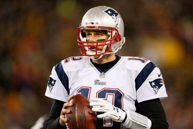 GREEN BAY, WI - NOVEMBER 30:  Quarterback Tom Brady #12 of the New England Patriots warms up on the sidelines during the NFL game against the Green Bay Packers at Lambeau Field on November 30, 2014 in Green Bay, Wisconsin. The Packers defeated the Patriots 26-21.  (Photo by Christian Petersen/Getty Images)