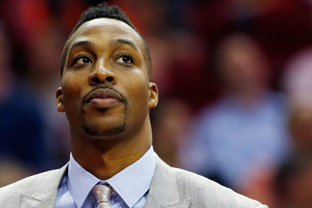 HOUSTON, TX - NOVEMBER 24:  Dwight Howard #12 of the Houston Rockets looks the court during their game against the New York Knicks at the Toyota Center on November 24, 2014 in Houston, Texas.  NOTE TO USER: User expressly acknowledges and agrees that, by downloading and/or using this photograph, user is consenting to the terms and conditions of the Getty Images License Agreement.  (Photo by Scott Halleran/Getty Images)