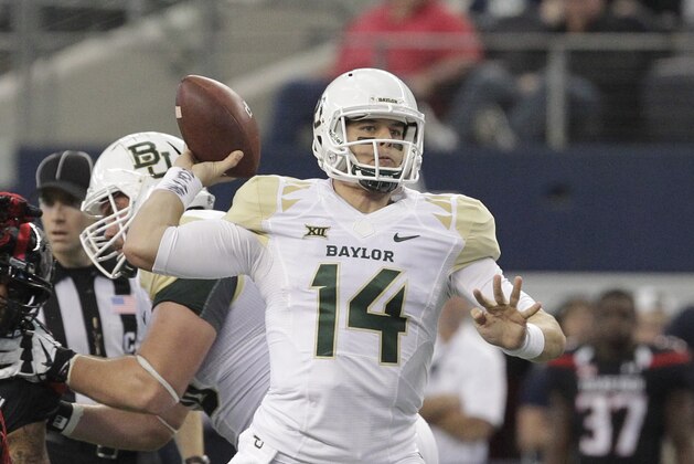Baylor quarterback Bryce Petty (14) throws against the Texas Tech in the first half of an NCAA college football game, Saturday, Nov. 29, 2014, in Arlington, Texas. (AP Photo/Tim Sharp)