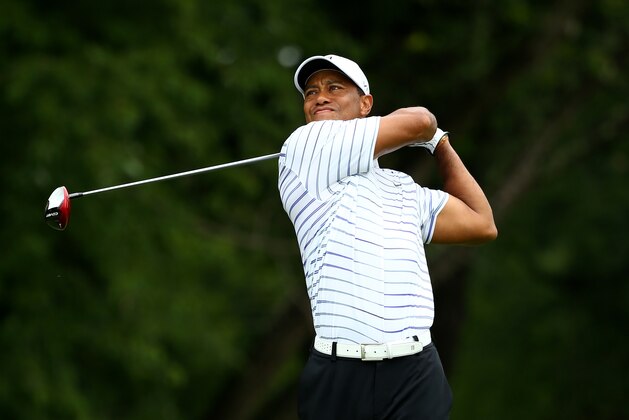 LOUISVILLE, KY - AUGUST 08:  Tiger Woods of the United States hits his tee shot on the fifth hole during the second round of the 96th PGA Championship at Valhalla Golf Club on August 8, 2014 in Louisville, Kentucky.  (Photo by Andy Lyons/Getty Images)