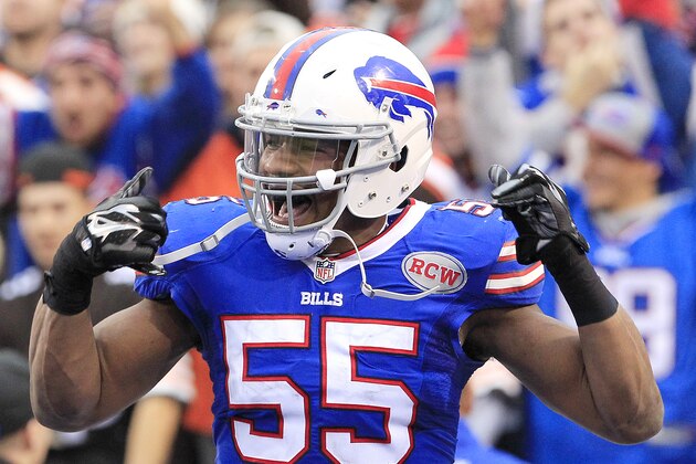 Buffalo Bills defensive end Jerry Hughes celebrates after scoring on a fumble recovery against the Cleveland Browns during the second half of an NFL football game, Sunday, Nov. 30, 2014, in Orchard Park, N.Y. (AP Photo/Bill Wippert)