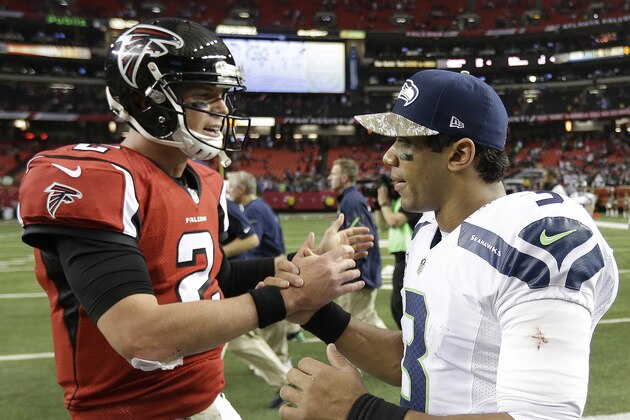 Atlanta Falcons quarterback Matt Ryan (2) speaks with Seattle Seahawks quarterback Russell Wilson (3) after the second half of an NFL football game, Sunday, Nov. 10, 2013, in Atlanta. The Seattle Seahawks won 33-10. (AP Photo/David Goldman)