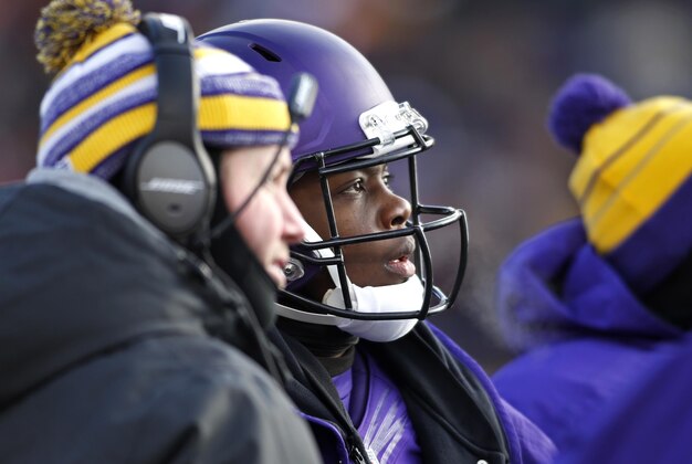 Nov 30, 2014; Minneapolis, MN, USA; Minnesota Vikings quarterback Teddy Bridgewater (5) watches a replay for a disputed run he made against the Carolina Panthers in the third quarter at TCF Bank Stadium. The Vikings win 31-13. Mandatory Credit: Bruce Kluckhohn-USA TODAY Sports