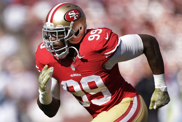 FILE - In this Nov. 10, 2013, file photo, San Francisco 49ers linebacker Aldon Smith warms up for the 49ers' NFL football game against the Carolina Panthers in San Francisco. Smith has been arrested at Los Angeles International Airport after authorities said he became belligerent during a security screening and threatened that he had a bomb. LAPD Sgt. Michael Fox said Smith was booked Sunday afternoon, April 13, 2014. AP Photo/Marcio Jose Sanchez, File)