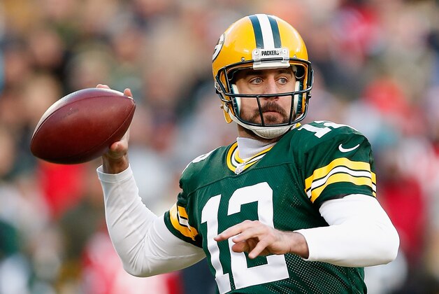 GREEN BAY, WI - NOVEMBER 30:  Quarterback Aaron Rodgers #12 of the Green Bay Packers throws a pass during the first quarter of the NFL game against the New England Patriots at Lambeau Field on November 30, 2014 in Green Bay, Wisconsin. The Packers defeated the Patriots 26-21.  (Photo by Christian Petersen/Getty Images)