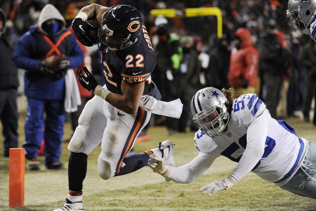 CHICAGO, IL - DECEMBER 9:  Matt Forte #22 of the Chicago Bears runs for a touchdown past Cameron Lawrence #53 of the Dallas Cowboys during the third quarter on December 9, 2013 at Soldier Field in Chicago, Illinois. (Photo by David Banks/Getty Images)
