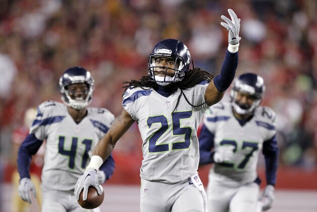 Nov 27, 2014; Santa Clara, CA, USA; Seattle Seahawks cornerback Richard Sherman (25) reacts after recording an interception against the San Francisco 49ers in the first quarter at Levi's Stadium. Mandatory Credit: Cary Edmondson-USA TODAY Sports