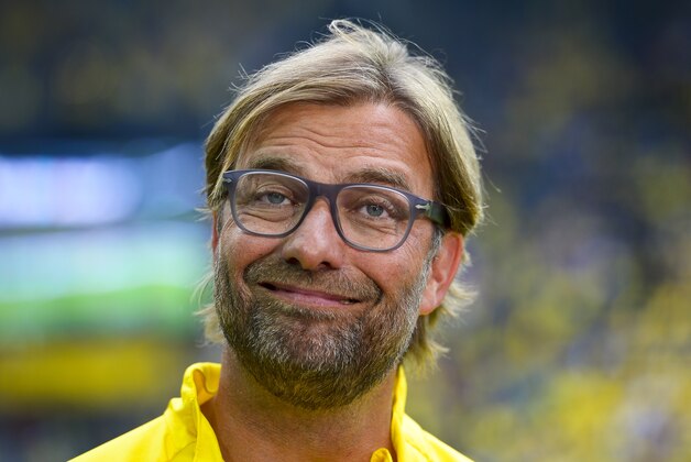 Dortmund's head coach Juergen Klopp smiles during the German soccer Super Cup match between Borussia Dortmund and Bayern Munich in Dortmund, Germany, Wednesday, Aug. 13, 2014. (AP Photo/Sascha Schuermann)