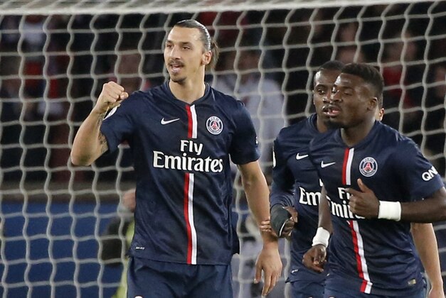 Paris Saint Germain's Zlatan Ibrahimovic reacts after he scores his side's first goal  by a penalty against Nice during their League One soccer match, at at Parc des Prince in Paris Saturday, Nov. 29, 2014. (AP Photo/Francois Mori)