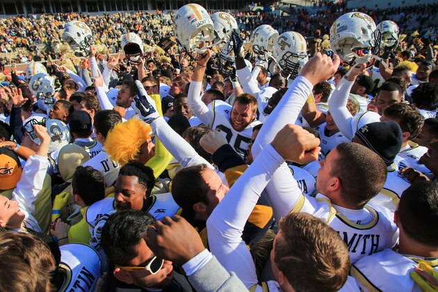 ATLANTA, GA - NOVEMBER 15:  The Georgia Tech Yellow Jackets celebrate as fans rush the field after beating the Clemson Tigers at Bobby Dodd Stadium on November 15, 2014 in Atlanta, Georgia. Georgia Tech won 28-6.  (Photo by Daniel Shirey/Getty Images)
