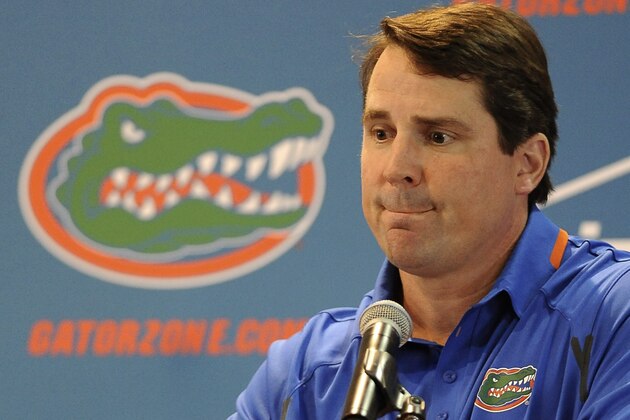 Florida NCAA college head football coach Will Muschamp fields questions from reporters during Media Day at the University of Florida in Gainesville, Fla., Sunday, Aug, 3, 2014.  (AP Photo/Phil Sandlin)
