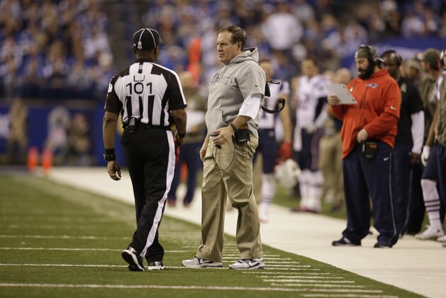 New England Patriots head coach Bill Belichick speaks with field judge Buddy Horton during the second half of an NFL football game against the Indianapolis Colts in Indianapolis, Sunday, Nov. 16, 2014. (AP Photo/AJ Mast)