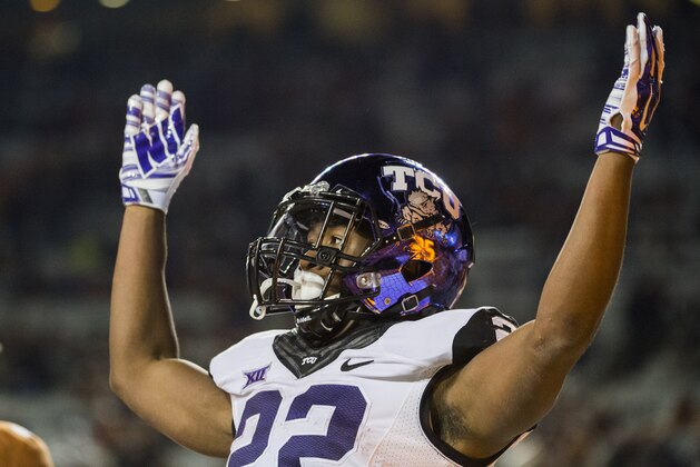 TCU's Aaron Green (22) celebrates a touchdown during the second half of an NCAA college football game against Texas, Thursday, Nov. 27, 2014, in Austin, Texas. (AP Photo/Ashley Landis)