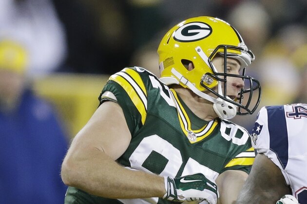 New England Patriots' Darrelle Revis (24) and Green Bay Packers' Jordy Nelson (87) line up during the second half of an NFL football game Sunday, Nov. 30, 2014, in Green Bay, Wis. (AP Photo/Tom Lynn)