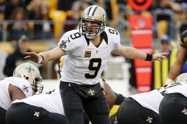 New Orleans Saints quarterback Drew Brees (9) changes a play at the line of scrimmage during the second half of an NFL football game against the Pittsburgh Steelers in Pittsburgh, Sunday, Nov. 30, 2014. (AP Photo/Gene J. Puskar)
