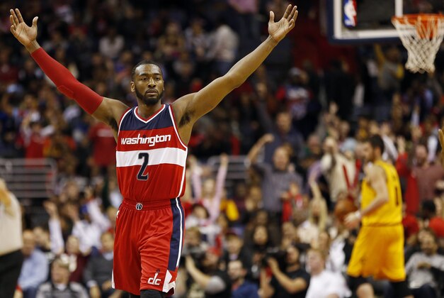 Nov 21, 2014; Washington, DC, USA; Washington Wizards guard John Wall (2) celebrates on the court against the Cleveland Cavaliers in the fourth quarter at Verizon Center. The Wizards won 91-78. Mandatory Credit: Geoff Burke-USA TODAY Sports