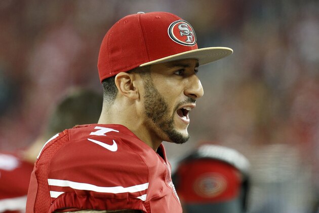 San Francisco 49ers quarterback Colin Kaepernick (7) stands on the sideline during the second half of an NFL football game against the Seattle Seahawks in Santa Clara, Calif., Thursday, Nov. 27, 2014. (AP Photo/Tony Avelar)