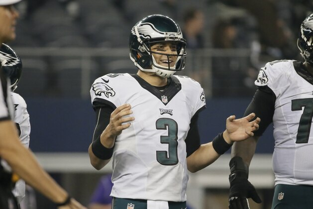 Philadelphia Eagles quarterback Mark Sanchez (3) smiles as he looks to the sideline in the final two minutes of an NFL football game against the Dallas Cowboys, Thursday, Nov. 27, 2014, in Arlington, Texas. The Eagles won 33-10. (AP Photo/Brandon Wade)