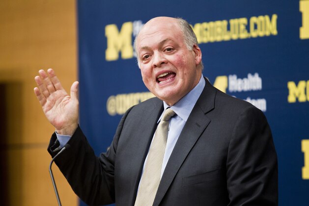 Michigan interim athletic director Jim Hackett announces the immediate dismissal of head coach Brady Hoke during a press conference in Ann Arbor, Mich., Tuesday, Dec. 2, 2014. (AP Photo/Tony Ding)
