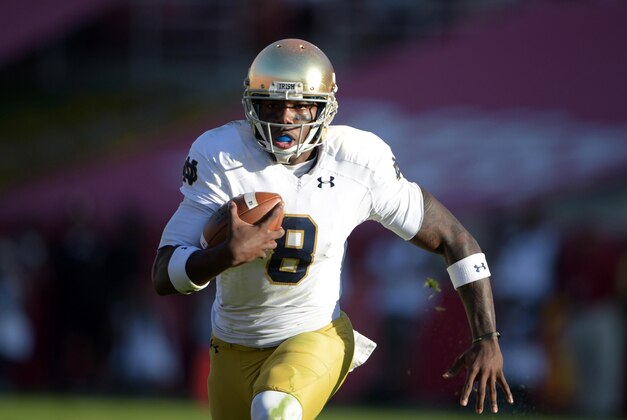 Nov 29, 2014; Los Angeles, CA, USA; Notre Dame Fighting Irish quarterback Malik Zaire (8) against the Southern California Trojans at Los Angeles Memorial Coliseum. USC defeated Notre Dame 49-14. Mandatory Credit: Kirby Lee-USA TODAY Sports Nov 29, 2014; Los Angeles, CA, USA; Notre Dame Fighting Irish quarterback Malik Zaire (8) against the Southern California Trojans at Los Angeles Memorial Coliseum. USC defeated Notre Dame 49-14. Mandatory Credit: Kirby Lee-USA TODAY Sports