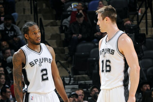 SAN ANTONIO, TX - NOVEMBER 17: Kawhi Leonard #2 and Aron Baynes #16 of the San Antonio Spurs speak on the court during a game against the Philadelphia 76ers at the AT&T Center on November 17, 2014 in San Antonio, Texas. NOTE TO USER: User expressly acknowledges and agrees that, by downloading and or using this photograph, user is consenting to the terms and conditions of the Getty Images License Agreement. Mandatory Copyright Notice: Copyright 2014 NBAE (Photos by D. Clarke Evans/NBAE via Getty Images)
