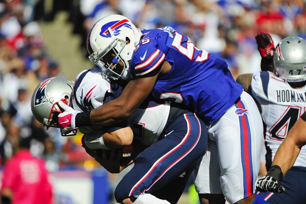 Buffalo Bills defensive end Jerry Hughes (55) sacks New England Patriots' Tom Brady (12) during the first half of an NFL football game Sunday, Oct. 12, 2014, in Orchard Park, N.Y. (AP Photo/Gary Wiepert)