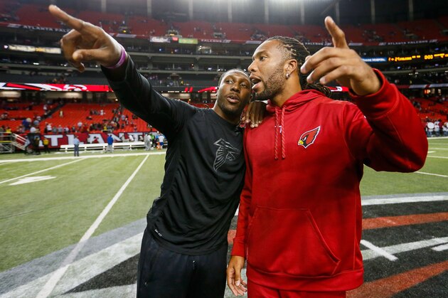ATLANTA, GA - NOVEMBER 30:  Roddy White #84 of the Atlanta Falcons talks to Larry Fitzgerald #11 of the Arizona Cardinals on the field after the game at the Georgia Dome on November 30, 2014 in Atlanta, Georgia. The Falcons won 29-18.  (Photo by Kevin C. Cox/Getty Images)