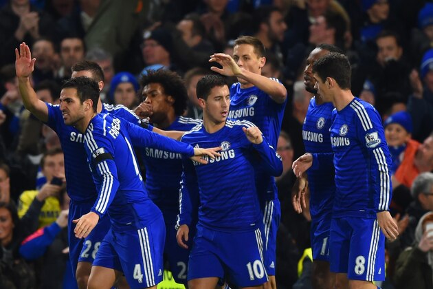 LONDON, ENGLAND - DECEMBER 03:  Eden Hazard of Chelsea celebrates with team mates after scoring the opening goal during the Barclays Premier League match between Chelsea and Tottenham Hotspur at Stamford Bridge on December 3, 2014 in London, England.  (Photo by Shaun Botterill/Getty Images)