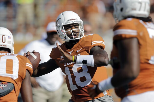 Texas’ Tyrone Swoopes (18) warms up prior to an NCAA college football game against West Virginia, Saturday, Nov. 8, 2014, in Austin, Texas. (AP Photo/Eric Gay)