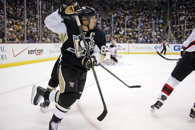 Pittsburgh Penguins' Sidney Crosby (87) skates in the corner during the second period of an NHL hockey game against the New Jersey Devils in Pittsburgh Tuesday, Dec. 2, 2014.(AP Photo/Gene Puskar